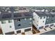 Modern townhomes from above, highlighting garages and solar panels at 2052 Alcott Way, Broomfield, CO 80023