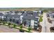Townhome community showcasing consistent architecture and landscaping at 2052 Alcott Way, Broomfield, CO 80023
