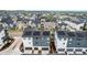 Aerial shot of modern townhomes with solar panels in a suburban neighborhood at 2052 Alcott Way, Broomfield, CO 80023