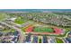 Gorgeous aerial view of a community with a football field, school, walking paths and many single Gathering homes at 2052 Alcott Way, Broomfield, CO 80023