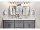 Elegant bathroom with double vanity, neutral color scheme, and modern light fixtures at 2052 Alcott Way, Broomfield, CO 80023