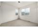 Well-lit bedroom with neutral carpet, light fixtures, and bright white paint at 2052 Alcott Way, Broomfield, CO 80023