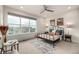 Inviting bedroom with large window, neutral decor, stylish lamps, and comfortable bed at 2052 Alcott Way, Broomfield, CO 80023