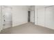 Bright bedroom with ensuite bathroom, neutral carpet, and ample closet space at 2052 Alcott Way, Broomfield, CO 80023