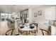 Cozy dining area featuring a round table, seating for four, a window seat and hardwood floors at 2052 Alcott Way, Broomfield, CO 80023