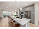 Spacious kitchen featuring a large island with seating, stainless steel appliances, and modern finishes at 2052 Alcott Way, Broomfield, CO 80023