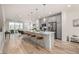 Spacious open-concept featuring a large island with seating and stainless steel appliances at 2052 Alcott Way, Broomfield, CO 80023