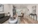 Open floor plan featuring a living room connecting the kitchen, dining area, and staircase at 2052 Alcott Way, Broomfield, CO 80023