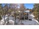 Luxury home with large deck and snowy landscape at 1151 Kenosha Dr, Larkspur, CO 80118