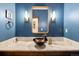 Stylish bathroom with a marble countertop, vessel sink, and modern fixtures at 1151 Kenosha Dr, Larkspur, CO 80118