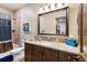 Bathroom with shower, tub, granite vanity, and updated fixtures at 1151 Kenosha Dr, Larkspur, CO 80118