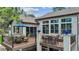 This is the deck with outdoor dining and seating areas, providing lovely views and relaxation space at 1151 Kenosha Dr, Larkspur, CO 80118