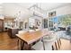 Bright dining room with large wood table and access to backyard patio at 1151 Kenosha Dr, Larkspur, CO 80118