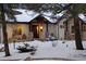 Charming home exterior with a welcoming covered entryway at 1151 Kenosha Dr, Larkspur, CO 80118