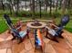 Landscaped backyard with firepit and unique chairs at 1151 Kenosha Dr, Larkspur, CO 80118