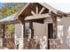 Detailed view of the home's front entrance with stone columns at 1151 Kenosha Dr, Larkspur, CO 80118