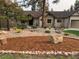 Attractive home showcasing a stone and stucco exterior, and well-kept landscaping at 1151 Kenosha Dr, Larkspur, CO 80118