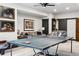 Basement game room with ping pong table and comfortable seating at 1151 Kenosha Dr, Larkspur, CO 80118