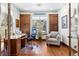 Bright home office features built-in cabinets and wood floors at 1151 Kenosha Dr, Larkspur, CO 80118