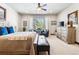 Spacious main bedroom with a king-size bed and ample natural light at 1151 Kenosha Dr, Larkspur, CO 80118