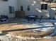 Stone patio with outdoor seating area in winter at 1151 Kenosha Dr, Larkspur, CO 80118