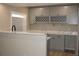 This bar features gray cabinets, quartz countertops, and ample wine storage at 20630 E Hamilton Ave, Aurora, CO 80013