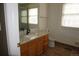 Bright bathroom features a modern sink, vanity with stone countertop, and tiled floors at 20630 E Hamilton Ave, Aurora, CO 80013