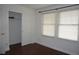 The bright bedroom features a closet, hardwood floors and ample natural light from windows at 20630 E Hamilton Ave, Aurora, CO 80013