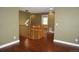 This foyer features hardwood floors, wood banisters, and views of the home's interior at 20630 E Hamilton Ave, Aurora, CO 80013