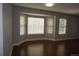 Bright living room featuring hardwood floors, neutral paint and a bay window that provides ample natural light at 20630 E Hamilton Ave, Aurora, CO 80013