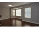 Bright living room featuring hardwood floors, neutral paint and a bay window that provides ample natural light at 20630 E Hamilton Ave, Aurora, CO 80013