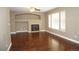 Cozy living room with hardwood floors and a fireplace, ideal for gatherings and relaxation at 20630 E Hamilton Ave, Aurora, CO 80013