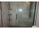 Marble tiled shower stall features a gray shower system with integrated shower heads and modern fixtures at 20630 E Hamilton Ave, Aurora, CO 80013