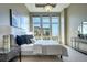 Bright bedroom with floor-to-ceiling windows and water views at 5455 Landmark Pl # 1403, Greenwood Village, CO 80111