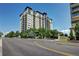 Luxury high-rise condo building with modern architecture and manicured landscaping at 5455 Landmark Pl # 1403, Greenwood Village, CO 80111