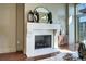 A cozy fireplace with a decorative mantel and mirror, enhancing the room's character at 5455 Landmark Pl # 1403, Greenwood Village, CO 80111