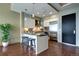 Modern kitchen featuring stainless steel appliances, granite countertops, breakfast bar with seating, and contemporary lighting at 5455 Landmark Pl # 1403, Greenwood Village, CO 80111