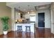 Modern kitchen features stainless steel appliances, white cabinets, granite countertops, and a breakfast bar with seating at 5455 Landmark Pl # 1403, Greenwood Village, CO 80111