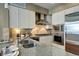Close up of a modern kitchen with stainless steel appliances and granite countertops at 5455 Landmark Pl # 1403, Greenwood Village, CO 80111