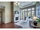 Bright and airy living room showcasing a stone fireplace and expansive windows for ample natural light at 5455 Landmark Pl # 1403, Greenwood Village, CO 80111