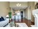 Bright living area offering a cozy fireplace and an open view into the modern kitchen space at 5455 Landmark Pl # 1403, Greenwood Village, CO 80111