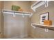 Bright walk-in closet featuring multiple shelves and clothing rods with a neutral color scheme at 5455 Landmark Pl # 1403, Greenwood Village, CO 80111