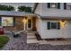 Beautiful home featuring brick and vinyl siding, complemented by a well-manicured yard with decorative elements at 7021 S Eudora St, Centennial, CO 80122