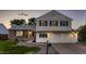 Charming two-story home with a well-maintained lawn, large driveway and attached two car garage at 7021 S Eudora St, Centennial, CO 80122