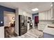 Modern kitchen showcasing stainless steel appliances, abundant storage, and seamless transition to living spaces at 7021 S Eudora St, Centennial, CO 80122