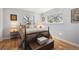 Bedroom with hardwood floors, vintage furnishings and filled with natural light at 8403 Chase Dr, Arvada, CO 80003
