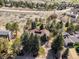 Overhead view of a property featuring mature trees and lush landscaping, with a private and serene setting at 7570 Windford, Parker, CO 80134