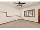 This bedroom features a ceiling fan, natural lighting, and neutral-toned walls at 7570 Windford, Parker, CO 80134