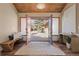 Welcoming foyer with wood ceiling, double doors, bench seating, and console table at 7570 Windford, Parker, CO 80134