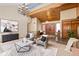 Open living space featuring a wood ceiling, unique railing, and stylish furnishings at 7570 Windford, Parker, CO 80134